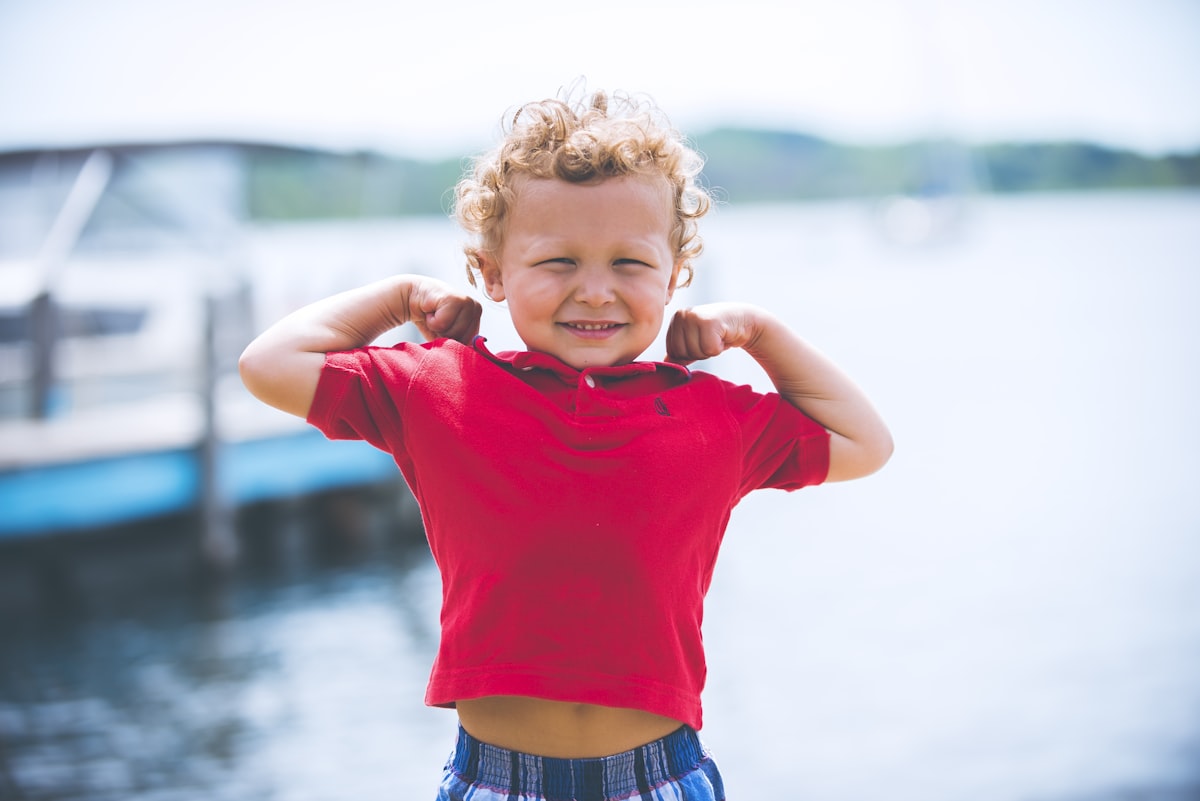 A young Rim Country child smiling by the lake